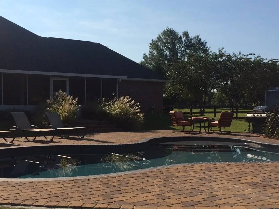 Free-form residential pool and paver patio